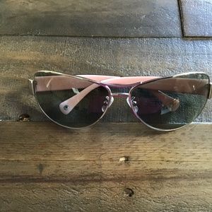 Coach sunglasses, lavender inner arms, light grey lenses.